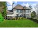 Expansive backyard view highlighting a deck and lush green lawn, perfect for outdoor entertaining at 1004 Windermere Xing, Cumming, GA 30041