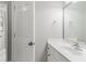 This bathroom features a large framed mirror, ample countertop space, and access to a bright standing shower at 1004 Windermere Xing, Cumming, GA 30041