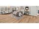Bright bedroom includes hardwood floors, an elegant sofa, and a plush bed for a relaxing atmosphere at 1004 Windermere Xing, Cumming, GA 30041