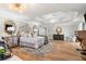 Spacious bedroom with a tray ceiling, plush carpet, a decorative fireplace and elegant furnishings for a luxurious feel at 1004 Windermere Xing, Cumming, GA 30041