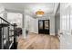Stunning entryway featuring wood floors, decorative columns, and abundant natural light at 1004 Windermere Xing, Cumming, GA 30041