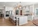 Bright kitchen with white cabinets, a large island, and modern appliances at 1004 Windermere Xing, Cumming, GA 30041