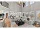 Bright, open living room featuring high ceilings, fireplace and seamless flow to the gourmet kitchen at 1004 Windermere Xing, Cumming, GA 30041