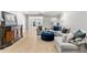 Cozy living room features a sofa, ottoman, console, and neutral tones at 1004 Windermere Xing, Cumming, GA 30041