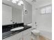 Compact bathroom with white vanity, dark countertop, and shower-tub combo at 135 S Falcon Blf, Alpharetta, GA 30022