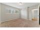 Cozy bedroom showcasing plush carpet, double windows, and a closet at 135 S Falcon Blf, Alpharetta, GA 30022