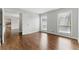 Sunlit bedroom showcasing gleaming hardwood floors and neutral paint at 135 S Falcon Blf, Alpharetta, GA 30022