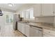Well-lit kitchen featuring stainless steel appliances and granite countertops at 135 S Falcon Blf, Alpharetta, GA 30022