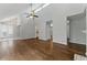 Bright living room featuring hardwood floors and modern light fixtures at 135 S Falcon Blf, Alpharetta, GA 30022