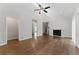 Inviting living room boasting vaulted ceilings, fireplace, and hardwood floors at 135 S Falcon Blf, Alpharetta, GA 30022