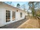 A wooden deck extends from the home offering an outdoor space to enjoy the peaceful backyard at 1596 Willowbrook Sw Dr, Atlanta, GA 30311