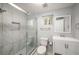 Modern bathroom featuring a sleek glass-enclosed shower with stylish tile and a contemporary vanity at 1596 Willowbrook Sw Dr, Atlanta, GA 30311