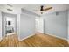 Bedroom featuring new ceiling fan, luxury vinyl floors, and ensuite bathroom at 1596 Willowbrook Sw Dr, Atlanta, GA 30311