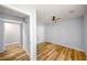 This bedroom features new ceiling fan, luxury vinyl floors, and spacious closet at 1596 Willowbrook Sw Dr, Atlanta, GA 30311