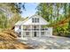 Stunning white two-story home with inviting double balconies and spacious driveway at 1596 Willowbrook Sw Dr, Atlanta, GA 30311