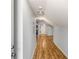Hallway features wood flooring, modern lighting, and neutral paint at 1596 Willowbrook Sw Dr, Atlanta, GA 30311