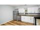 The kitchen has stainless steel appliances, granite countertops, and lots of white cabinets at 1596 Willowbrook Sw Dr, Atlanta, GA 30311