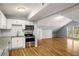 Open kitchen featuring stainless steel appliances and an adjoining living area at 1596 Willowbrook Sw Dr, Atlanta, GA 30311