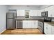 Modern kitchen features stainless steel appliances and granite countertops at 1596 Willowbrook Sw Dr, Atlanta, GA 30311