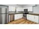 Modern kitchen features stainless steel appliances, granite countertops, and crisp, white cabinetry at 1596 Willowbrook Sw Dr, Atlanta, GA 30311