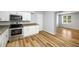 Open kitchen and dining area with stainless steel appliances and granite countertops at 1596 Willowbrook Sw Dr, Atlanta, GA 30311