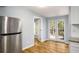 Bright kitchen featuring a stainless steel refrigerator and access to outdoor deck at 1596 Willowbrook Sw Dr, Atlanta, GA 30311
