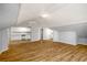 Open-concept living space featuring wood floors, recessed lighting, and an attached kitchen at 1596 Willowbrook Sw Dr, Atlanta, GA 30311