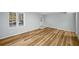 Bright room featuring new wood floors and a window, offering a seamless living experience at 1596 Willowbrook Sw Dr, Atlanta, GA 30311