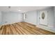Bright room featuring new wood floors and a modern front door, offering a seamless living experience at 1596 Willowbrook Sw Dr, Atlanta, GA 30311