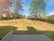 Large backyard featuring a well maintained lawn and wood privacy fence at 501 Fable Ln, Canton, GA 30114
