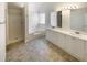 Bright bathroom with shower, soaking tub, dual vanity, and ample storage at 501 Fable Ln, Canton, GA 30114