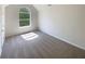 Bright, carpeted bedroom with vaulted ceiling, large window providing ample natural light at 501 Fable Ln, Canton, GA 30114