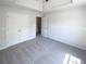 Bedroom featuring neutral carpeting, half wall trim, double door closet and tray ceiling at 501 Fable Ln, Canton, GA 30114