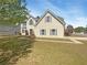 Charming two-story home with manicured lawn, mature shade tree, and delightful curb appeal at 501 Fable Ln, Canton, GA 30114