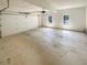 Spacious garage with roll-up door and lots of natural light at 501 Fable Ln, Canton, GA 30114