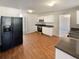 Open concept kitchen with stainless steel appliances, laminate floors and ample counter space at 501 Fable Ln, Canton, GA 30114