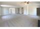 Open-concept living room featuring neutral carpeting and multiple doors at 501 Fable Ln, Canton, GA 30114