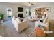 Bright, well-appointed living room featuring a fireplace, stylish furnishings, and large windows at 501 Fable Ln, Canton, GA 30114