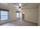Bedroom with neutral carpet, a ceiling fan, and windows with blinds at 625 Aunt Lucy Ln # 45, Smyrna, GA 30082