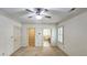 Bedroom features carpeted floors, bright windows with plantation shutters, and access to bathroom and closet at 625 Aunt Lucy Ln # 45, Smyrna, GA 30082
