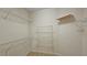 Walk-in closet features wire and wood shelving for ample storage space at 625 Aunt Lucy Ln # 45, Smyrna, GA 30082