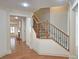 Entryway with wooden floors, staircase and view of the living room at 625 Aunt Lucy Ln # 45, Smyrna, GA 30082