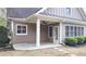 Inviting covered patio with ceiling fan and manicured landscaping enhance the appeal of this charming home at 625 Aunt Lucy Ln # 45, Smyrna, GA 30082