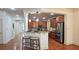 Beautiful kitchen with hardwood floors, stainless steel appliances, and a breakfast bar at 625 Aunt Lucy Ln # 45, Smyrna, GA 30082