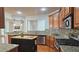 Updated kitchen features granite countertops, stainless appliances, island, hardwood floors, and mosaic backsplash at 625 Aunt Lucy Ln # 45, Smyrna, GA 30082