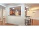 Gourmet kitchen featuring hardwood floors, modern appliances, and a breakfast bar at 625 Aunt Lucy Ln # 45, Smyrna, GA 30082