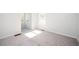 Bright bedroom with plush carpeting, white walls, and natural light from the window at 1005 Sims Nw Ave, Atlanta, GA 30318
