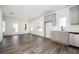 Modern kitchen boasts gray cabinets, stainless steel appliances, and beautiful wood-look flooring at 1005 Sims Nw Ave, Atlanta, GA 30318