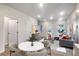 View of dining area flowing into living room featuring modern decor and hardwood flooring at 1005 Sims Nw Ave, Atlanta, GA 30318