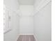 Walk-in closet featuring ample shelving space for organized storage at 1005 Sims Nw Ave, Atlanta, GA 30318